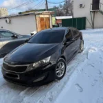 чорний Kia Optima вид спереду таксі Київ Житомир взимку