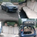 Київ Познань: синій кросовер Nissan Rogue, задні сидіння і багажник